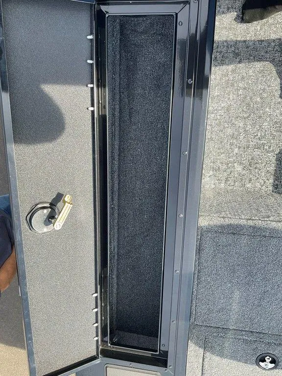 Slide: The Image of 2025 Tracker Targa™ V-18 WT boat storage compartment with lock. - 34