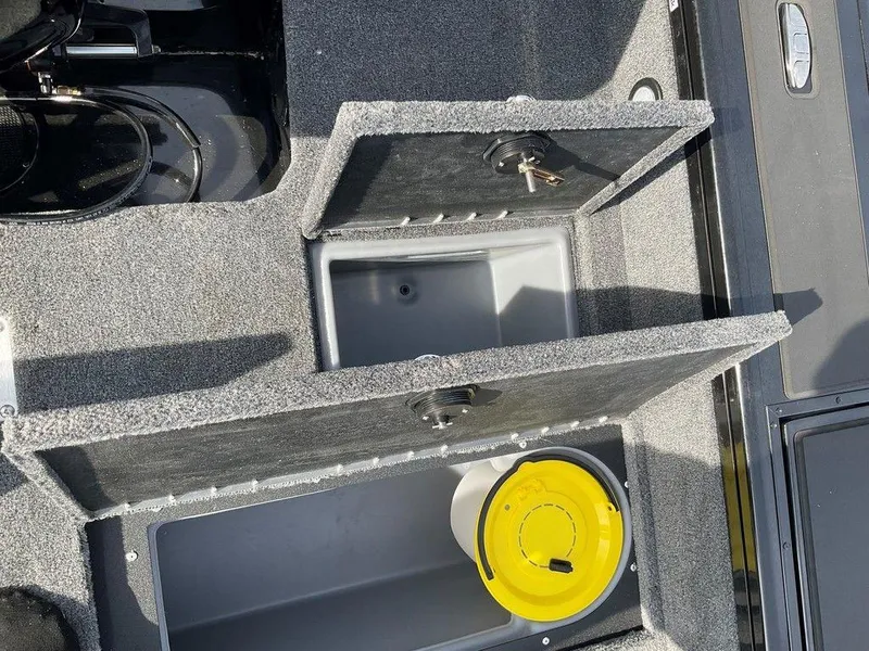Slide: The Image of 2025 Tracker Targa™ V-18 WT storage compartments with yellow bucket. - 36
