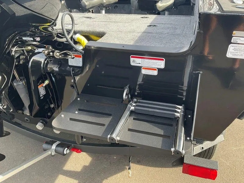 Slide: The Image of 2025 Tracker Targa™ V-18 WT boat with foldable swim ladder and motor details. - 43