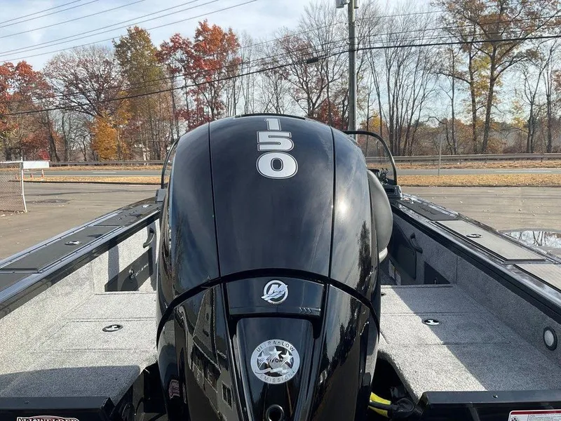 Slide: The Image of 2025 Tracker Targa™ V-18 WT boat with 150 HP engine, parked outdoors. - 44