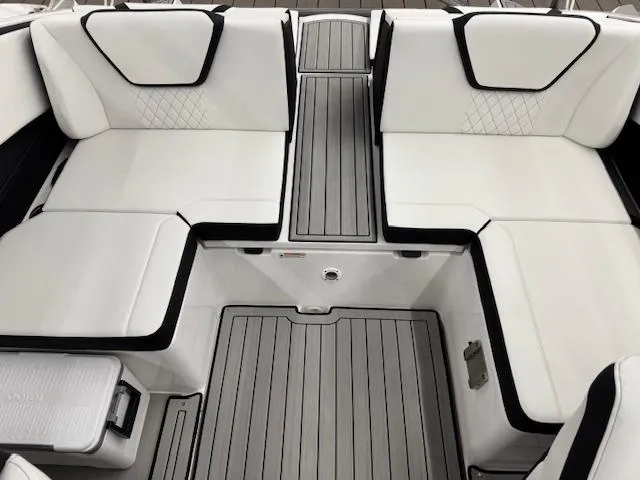 Slide: The Image of 2025 Yamaha Boats 222S interior with white seating and gray flooring. - 11