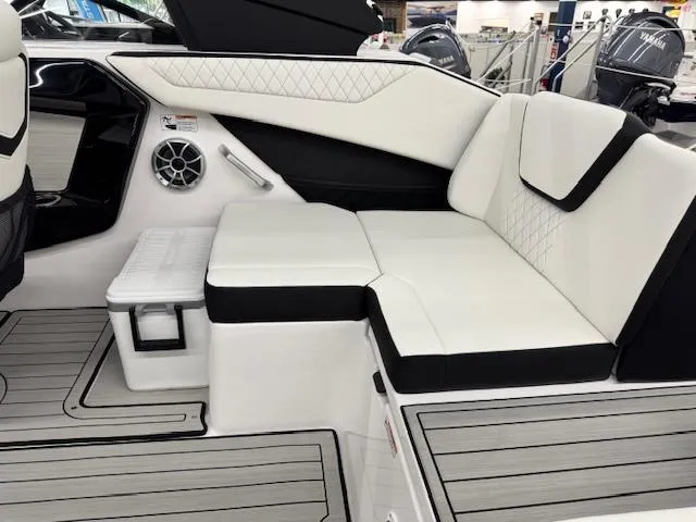 Slide: The Image of 2025 Yamaha Boats 222S interior with white cushioned seating and modern design. - 13