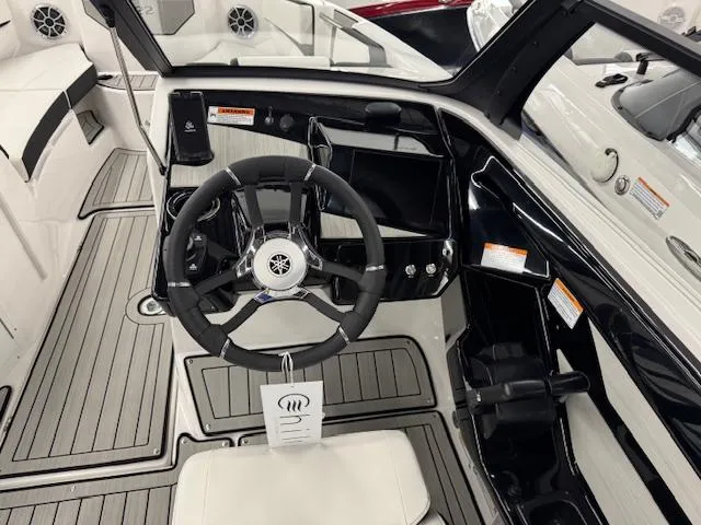 Slide: The Image of 2025 Yamaha Boats 222S cockpit with steering wheel and modern dashboard design. - 6