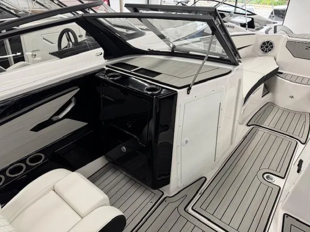Slide: The Image of 2025 Yamaha Boats 222S interior with sleek seating and modern dashboard design. - 7
