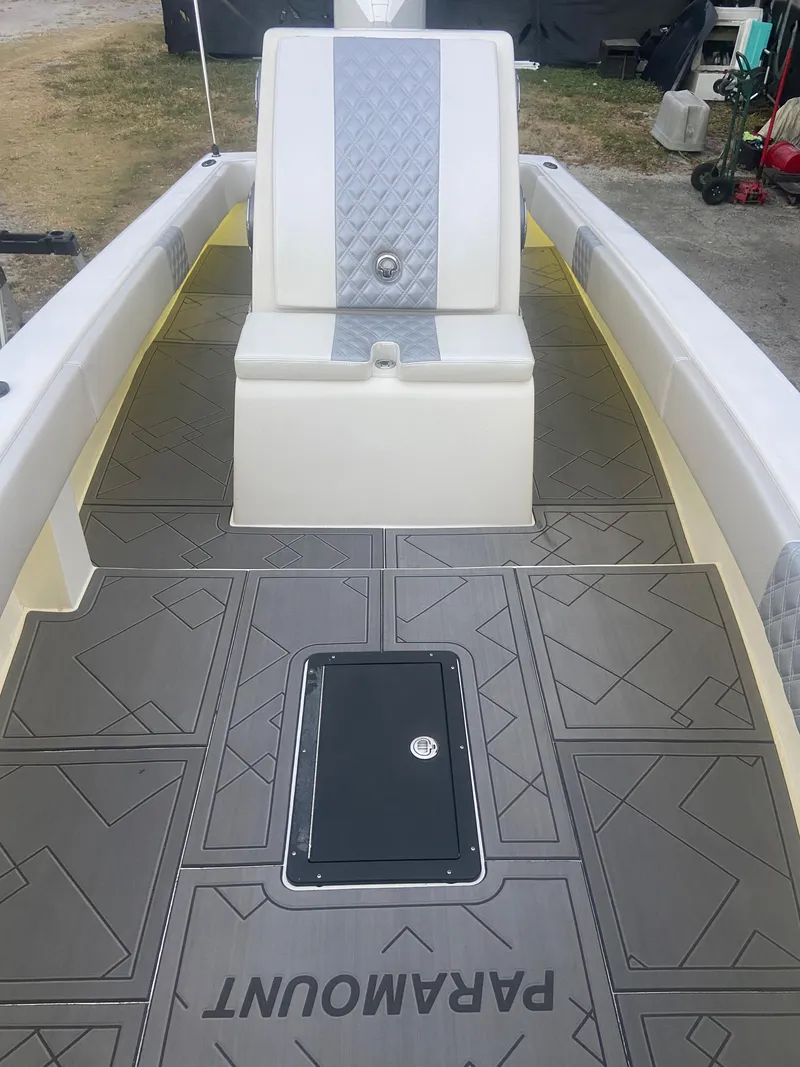 Slide: The Image of 1987 Paramount 21 boat interior with custom flooring and seating. - 19