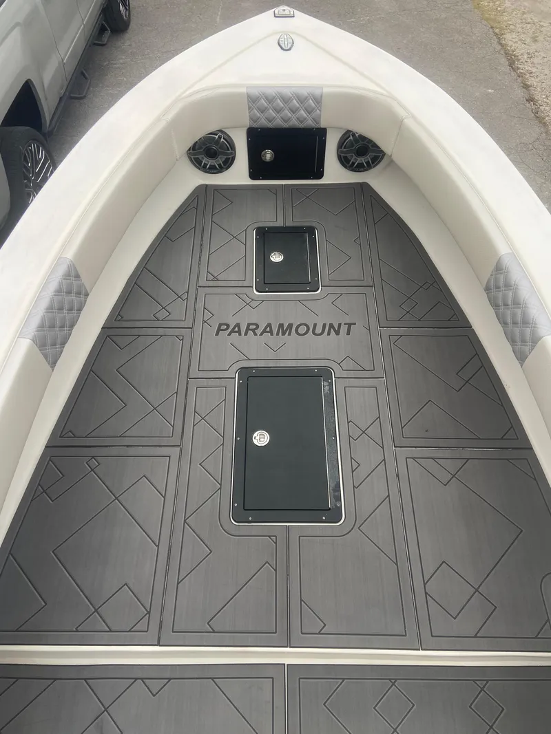 Slide: The Image of 1987 Paramount 21 boat interior with custom flooring and storage compartments. - 21