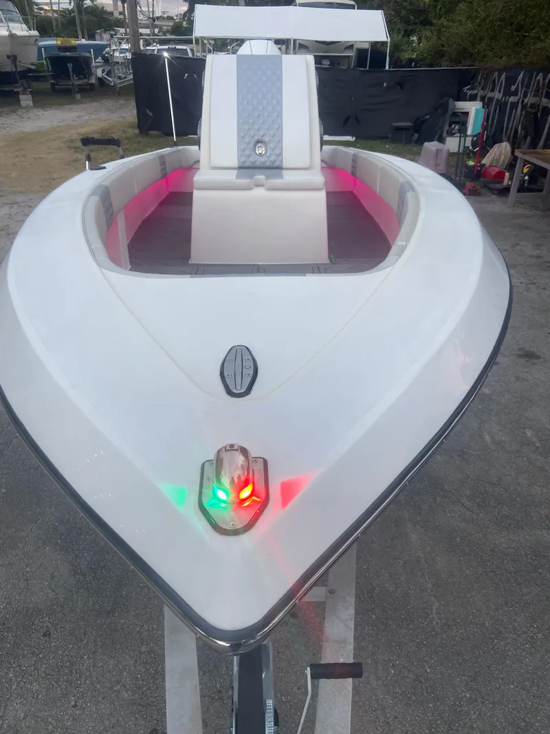 Slide: The Image of 1987 Paramount 21 boat with red and green navigation lights. - 23