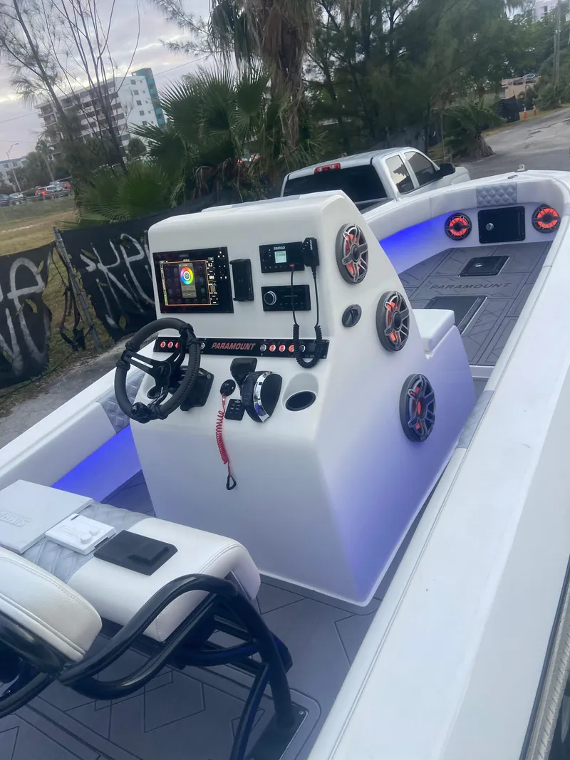 Slide: The Image of 1987 Paramount 21 boat interior with modern dashboard and steering wheel. - 5