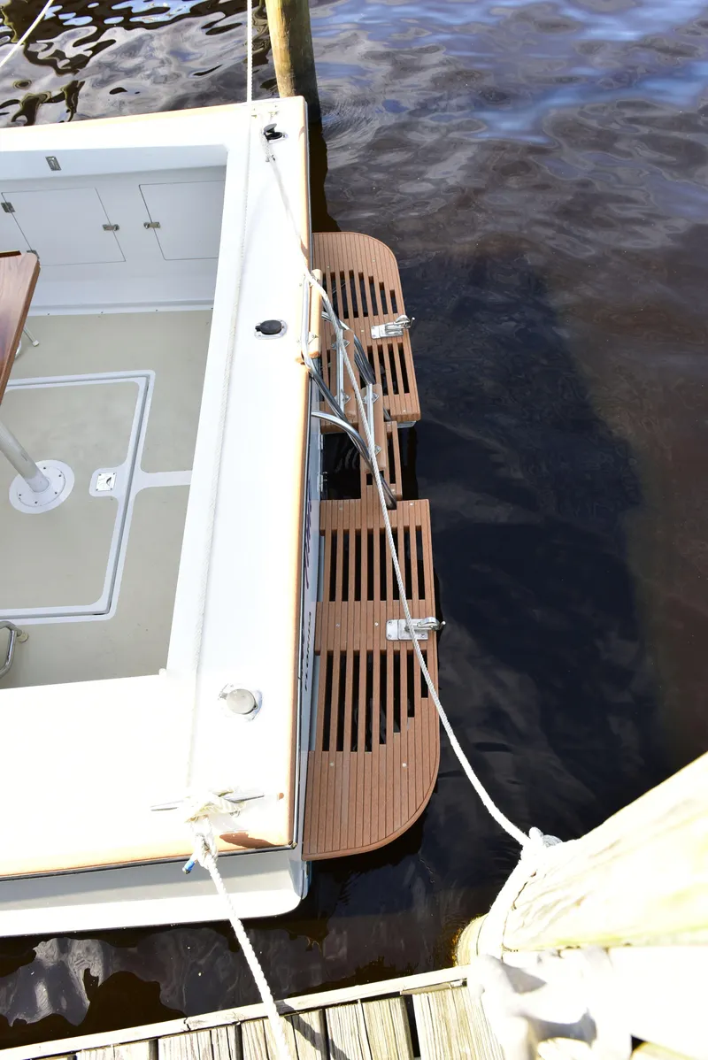 Slide: The Image of 1998 Duffy 35 Downeast Cruiser docked with wooden swim platform. - 17