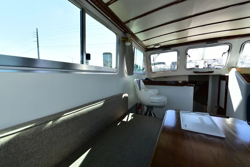 Slide: The Image of Interior of 1998 Duffy 35 Downeast Cruiser with seating and windows. - 22