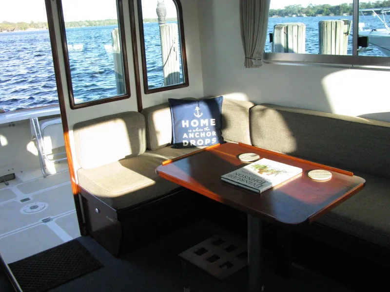 Slide: The Image of Interior of 1998 Duffy 35 Downeast Cruiser with cozy seating and nautical decor. - 27