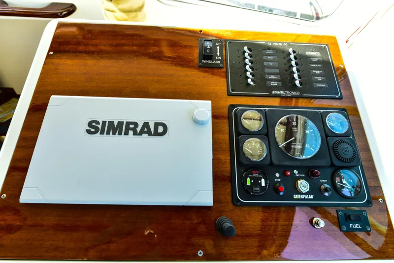 Slide: The Image of Control panel of a 1998 Duffy 35 Downeast Cruiser with Simrad navigation system. - 30