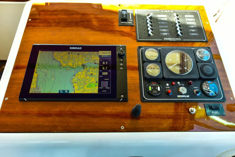 Slide: The Image of 1998 Duffy 35 Downeast Cruiser dashboard with navigation and control instruments. - 31