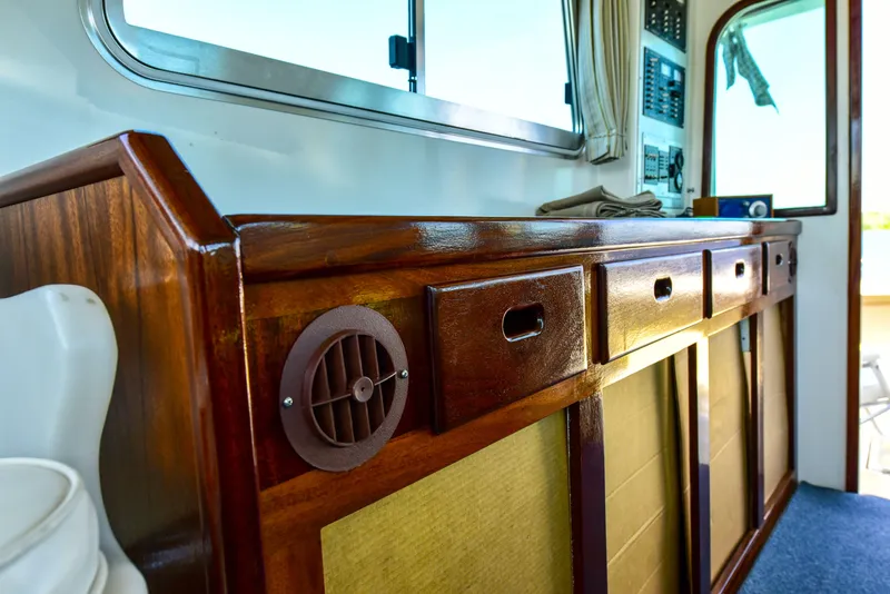 Slide: The Image of Interior of 1998 Duffy 35 Downeast Cruiser with polished wood cabinetry and nautical details. - 33