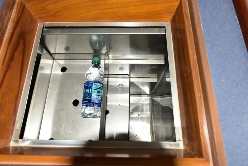 Slide: The Image of Stainless steel compartment with water bottle in 1998 Duffy 35 Downeast Cruiser. - 41