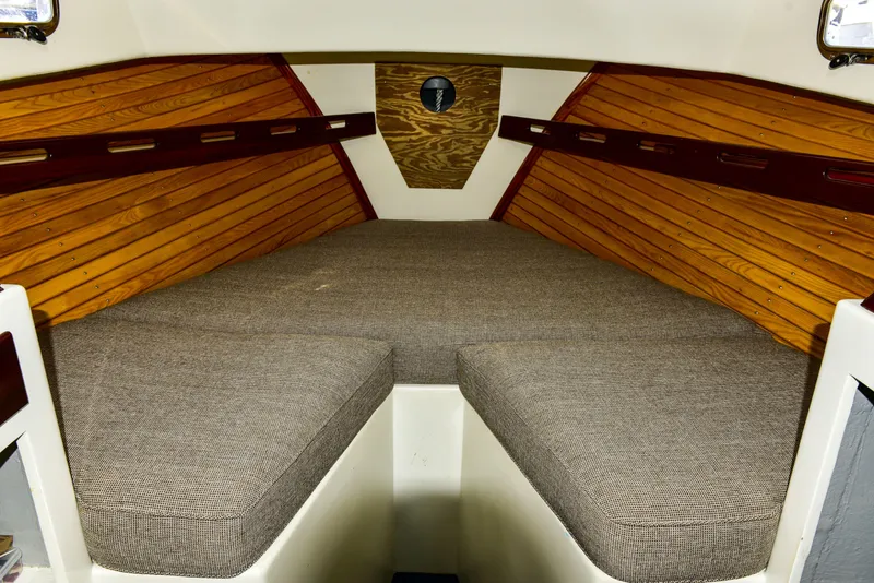 Slide: The Image of Interior cabin of 1998 Duffy 35 Downeast Cruiser with wood paneling and cushioned seating. - 46
