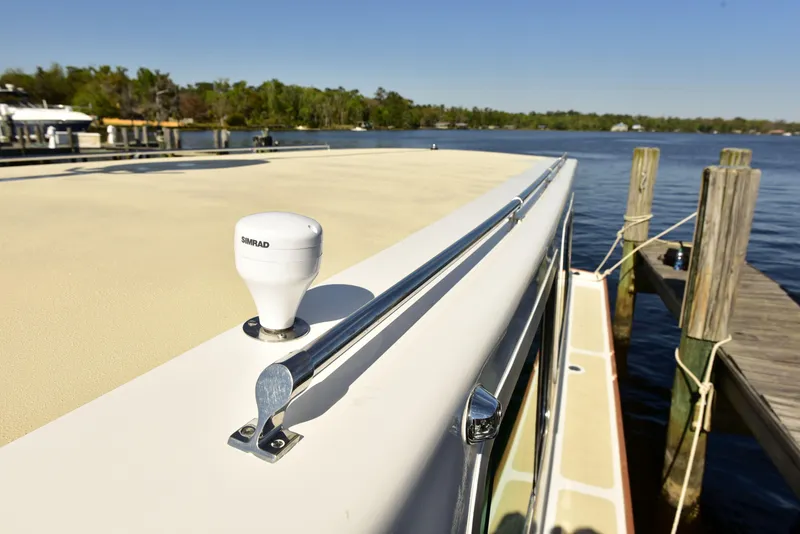 Slide: The Image of 1998 Duffy 35 Downeast Cruiser docked by a serene lake. - 5