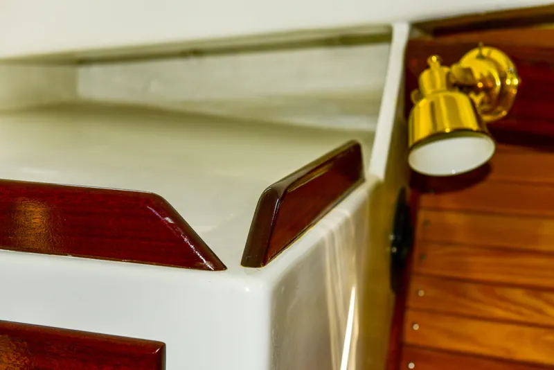 Slide: The Image of Interior detail of 1998 Duffy 35 Downeast Cruiser with wood trim and brass light fixture. - 51