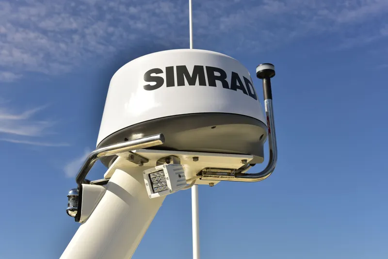 Slide: The Image of Simrad radar on 1998 Duffy 35 Downeast Cruiser against blue sky. - 6