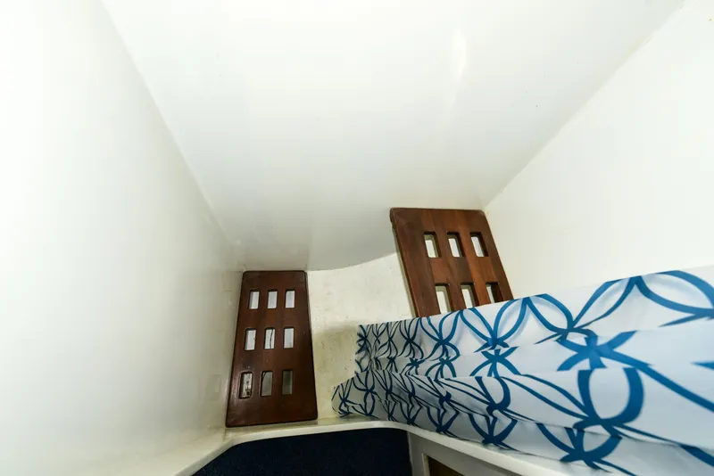 Slide: The Image of Interior cabin of 1998 Duffy 35 Downeast Cruiser with patterned bedding. - 62