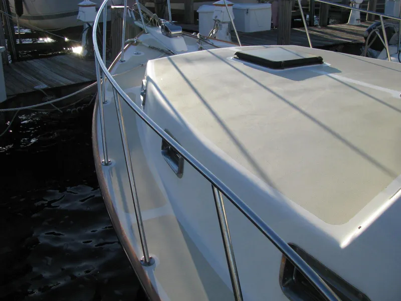 Slide: The Image of 1998 Duffy 35 Downeast Cruiser boat deck with railing, docked at marina. - 9
