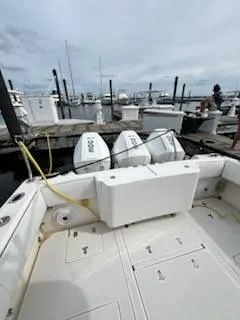 Slide: The Image of 2001 Intrepid 366 Cuddy boat docked with twin engines. - 10