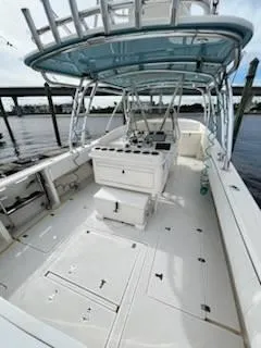 Slide: The Image of 2001 Intrepid 366 Cuddy boat with spacious deck and modern helm. - 11