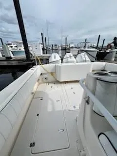 Slide: The Image of 2001 Intrepid 366 Cuddy boat docked at marina, spacious deck view. - 12