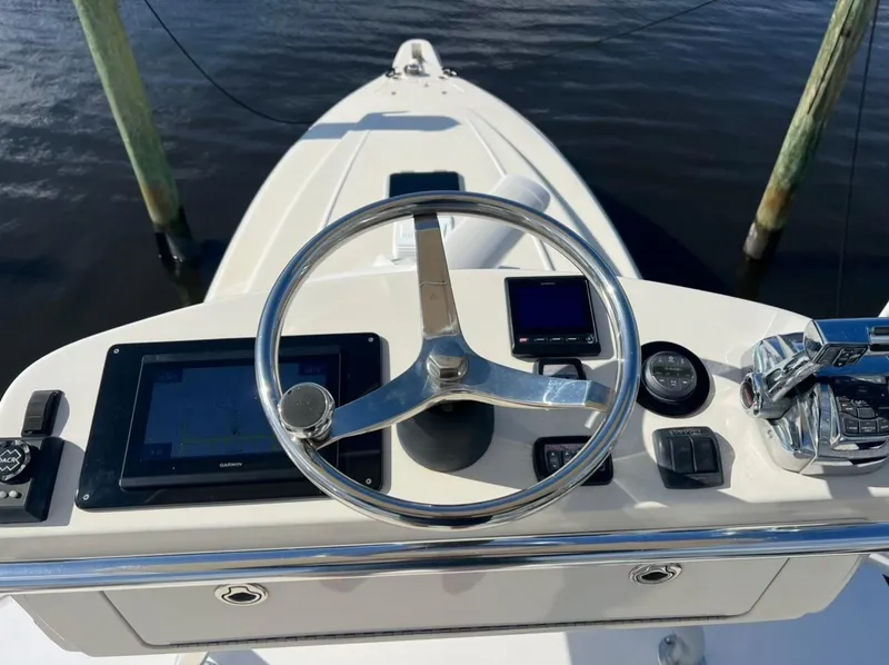 Slide: The Image of 2001 Intrepid 366 Cuddy helm with steering wheel and navigation controls. - 26