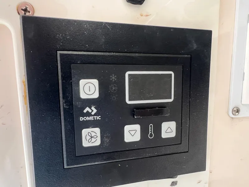 Slide: The Image of Dometic control panel on 2001 Intrepid 366 Cuddy boat. - 31