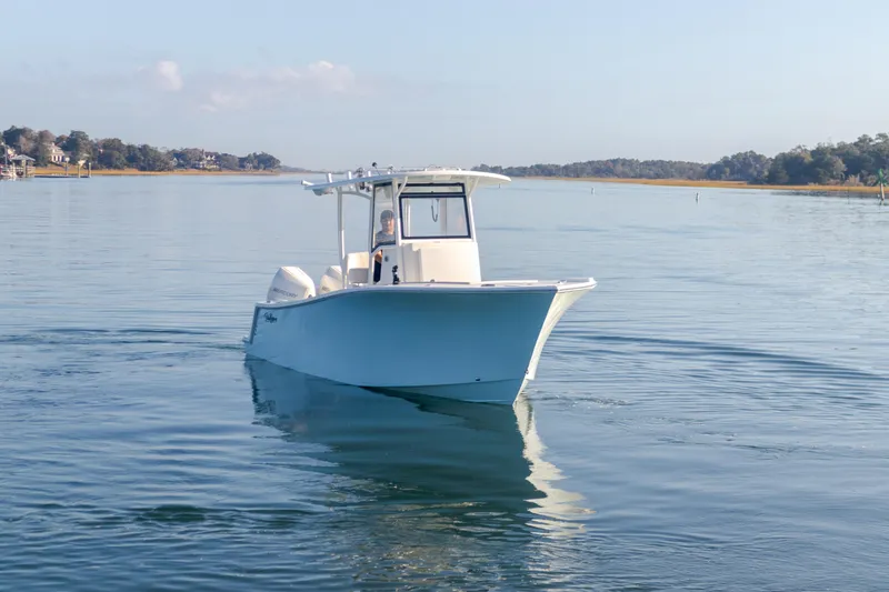 Slide: The Image of 2023 Pair Customs 25 Center Console boat on calm water. - 4