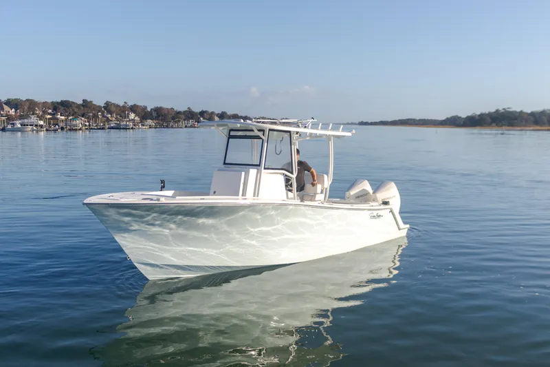 Slide: The Image of 2023 Pair Customs 25 Center Console boat on calm water. - 5