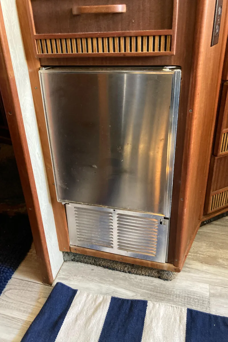 Slide: The Image of Stainless steel refrigerator in 1986 Sea Ray 340 Express Cruiser interior. - 14