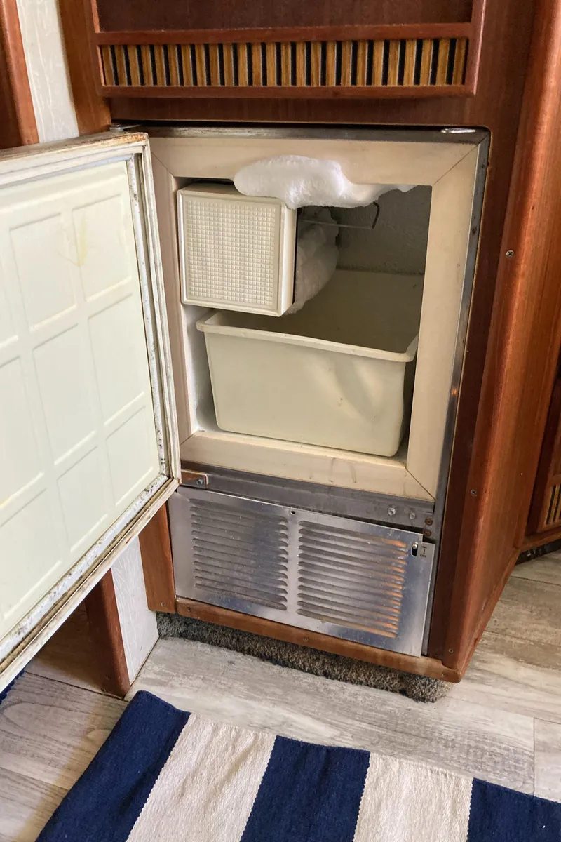 Slide: The Image of Open refrigerator inside 1986 Sea Ray 340 Express Cruiser boat cabin. - 15