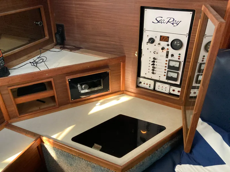 Slide: The Image of 1986 Sea Ray 340 Express Cruiser control panel and cabin interior. - 23