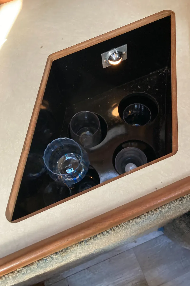 Slide: The Image of Built-in cup holder on 1986 Sea Ray 340 Express Cruiser. - 24