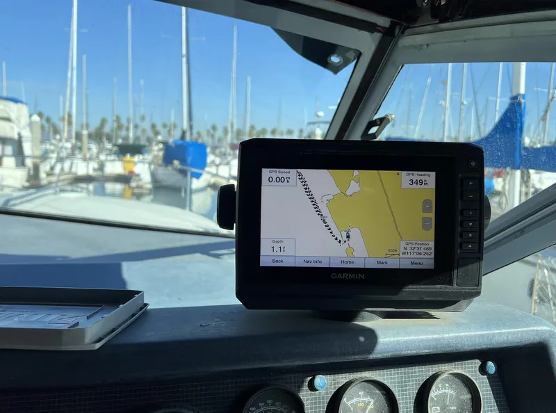 Slide: The Image of Garmin GPS on 1986 Sea Ray 340 Express Cruiser dashboard in marina. - 36