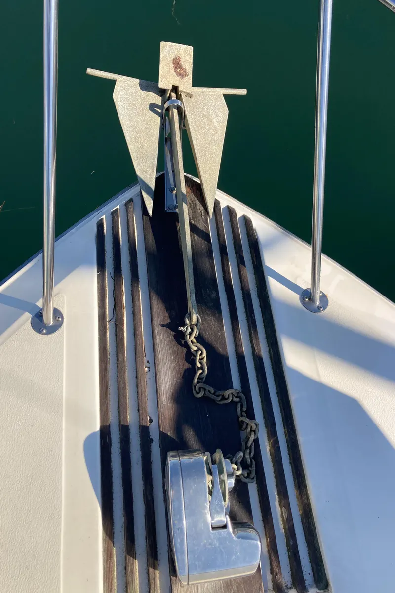 Slide: The Image of Anchor and chain on 1986 Sea Ray 340 Express Cruiser boat deck. - 42