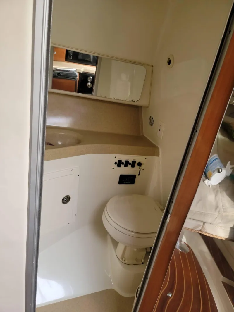 Slide: The Image of 2004 Hydra-Sports Vector 3300 VX boat bathroom interior with toilet and sink. - 10