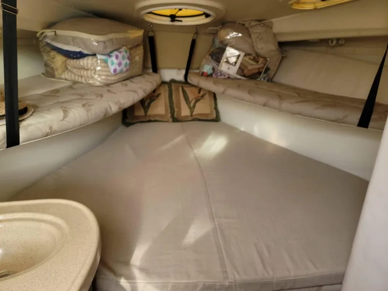 Slide: The Image of 2004 Hydra-Sports Vector 3300 VX cabin interior with cozy sleeping area and storage. - 11