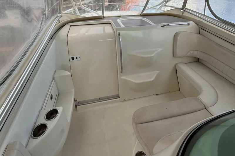 Slide: The Image of 2004 Hydra-Sports Vector 3300 VX interior with seating and cup holders. - 14