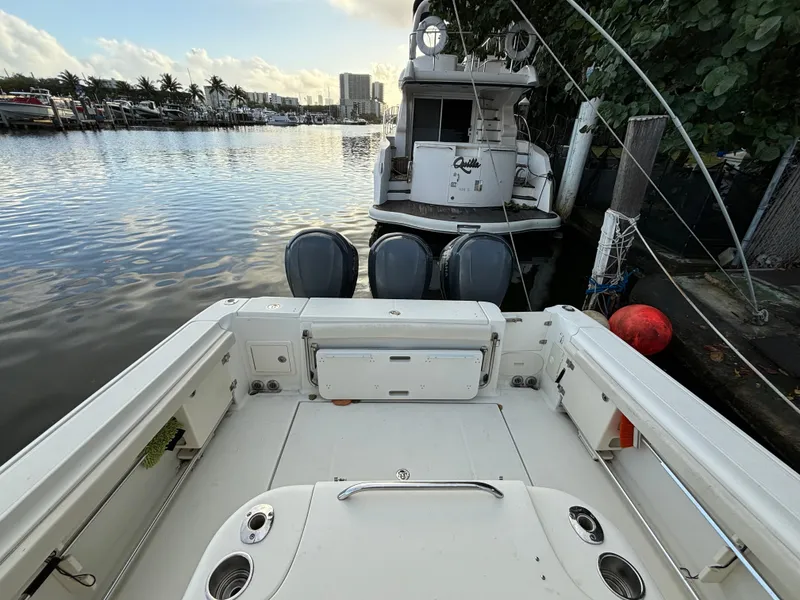 Slide: The Image of 2004 Hydra-Sports Vector 3300 VX boat docked at marina, rear view. - 4