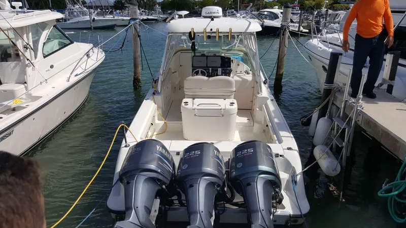Slide: The Image of 2004 Hydra-Sports Vector 3300 VX boat docked with triple Yamaha engines. - 6
