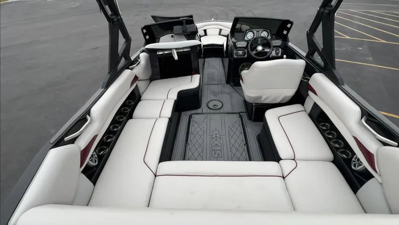 Slide: The Image of 2018 Axis Boats A22 interior with white seating and modern dashboard design. - 11