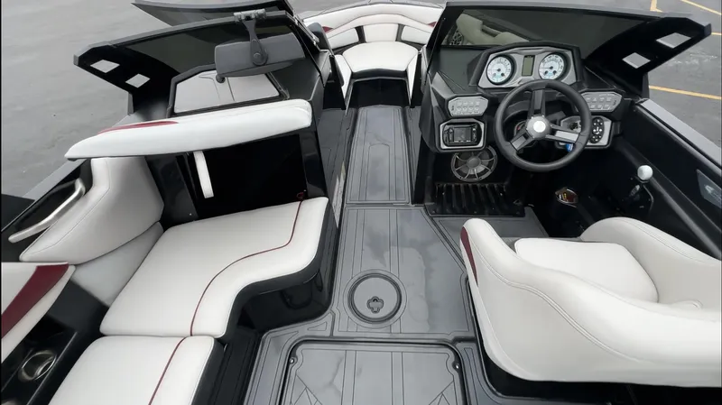 Slide: The Image of 2018 Axis Boats A22 interior with modern dashboard and comfortable seating. - 12