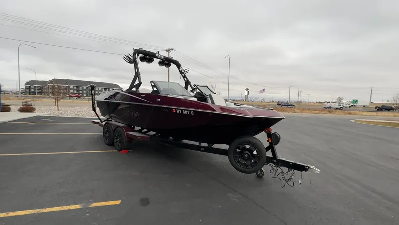 Slide: The Image of 2018 Axis Boats A22 on trailer in parking lot, overcast sky. - 5