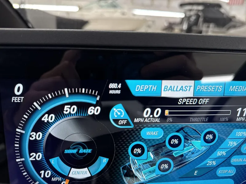 Slide: The Image of Dashboard display of a 2016 Malibu 25 LSV boat showing speed and ballast settings. - 17
