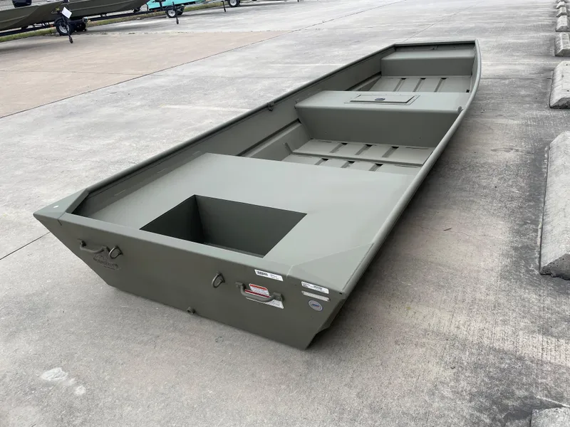 Slide: The Image of 2025 Tracker Grizzly 1542 Utility boat on concrete surface, showcasing spacious interior design. - 4