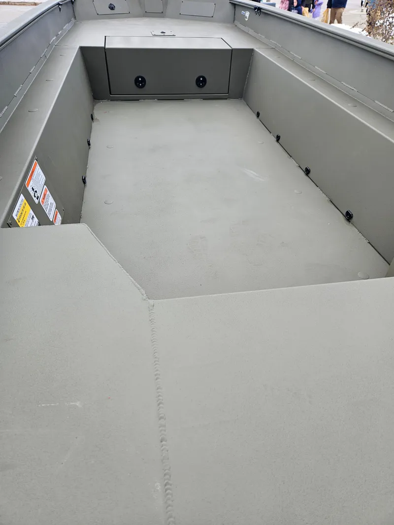 Slide: The Image of 2025 Tracker Grizzly 1650 T Prairie Wings Edition boat interior, spacious and durable design. - 2