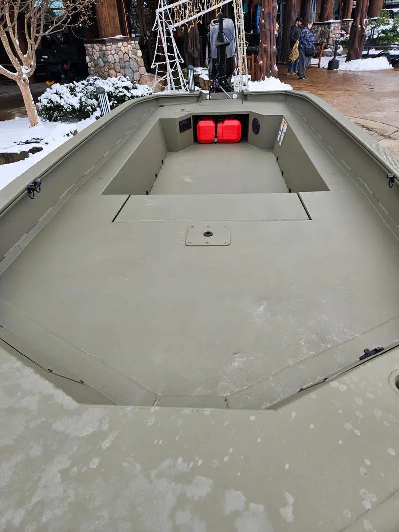 Slide: The Image of 2025 Tracker Grizzly 1650 T Prairie Wings Edition boat, spacious interior, outdoor setting. - 5